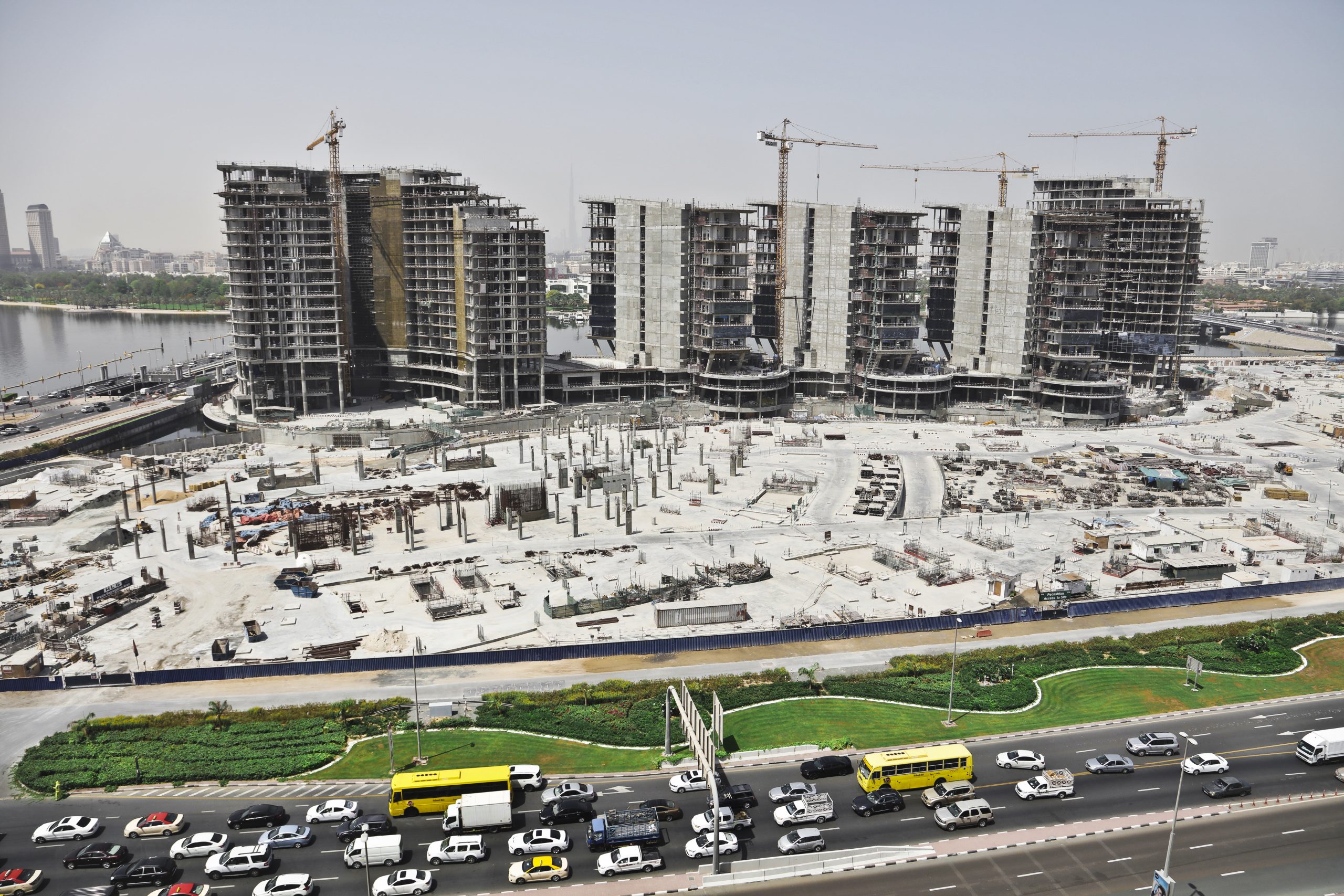 distant shot of an urban area with cars on the street and high buildings